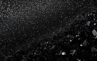 Obraz premium A dark glittery background with sparkling stars across a night sky. The shiny, grainy sand effect creates a mesmerizing glittering scene with a solid black foundation, perfect for dreamy designs.