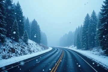 Fototapeta premium Snowflakes gently fall onto the winding highway under a thick foggy veil, gentle, soft, scenery