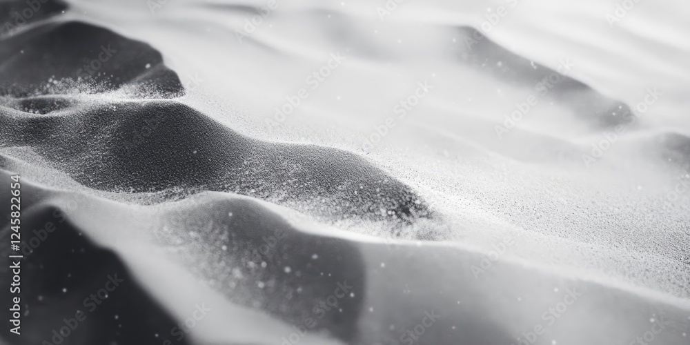 Aufkleber Abstract black and white sand dune landscape with soft wave patterns and fine particles softly glimmering against a blurred background.
