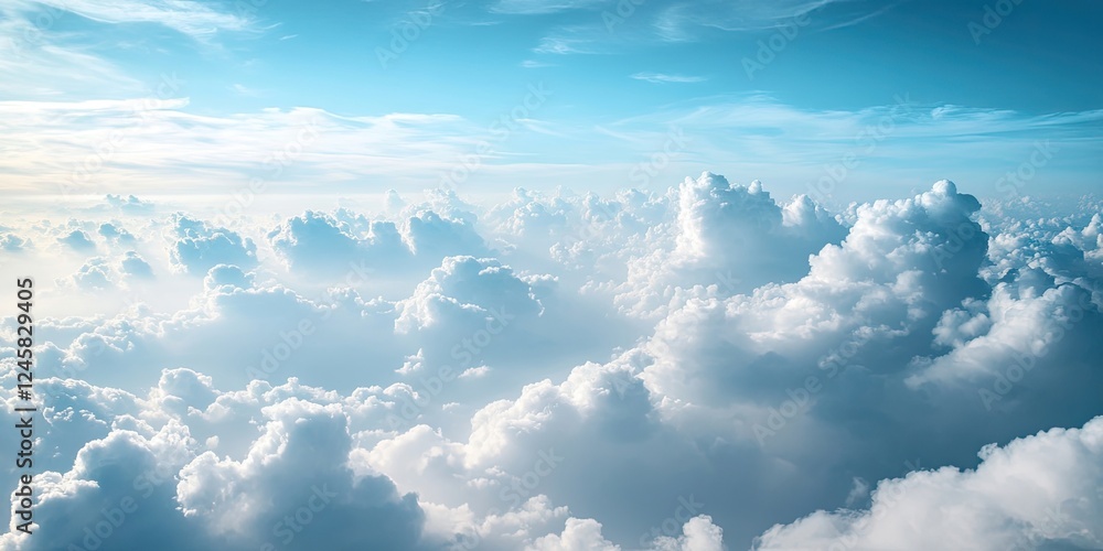 Poster Vast blue sky with soft white clouds filling the frame creating a serene and tranquil atmosphere ideal for backgrounds and nature themes.