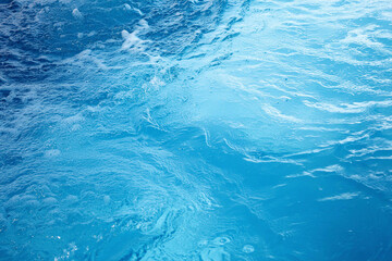 Fototapeta na wymiar Closeup blurred blue sea background, top view surface blue water. abstract summer background.