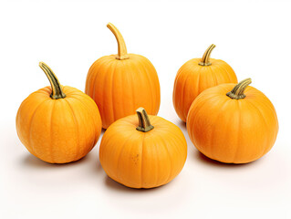Obraz premium Five small pumpkins arranged on a white background