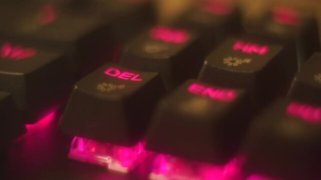 Wipe Data: Finger presses the DEL key in the dark