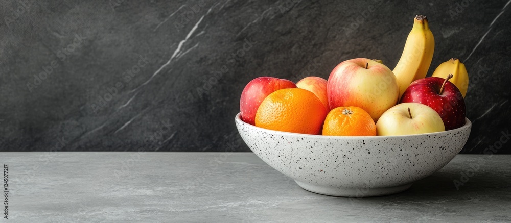 Poster aesthetic bowl of fresh apples bananas and oranges on a stone table with ample space for text or adv