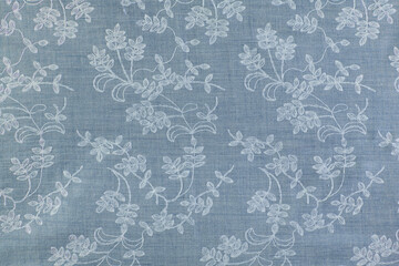 natural blue fabric with embroidered floral patterns