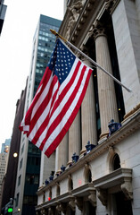 US flag in downtown against the backdrop of buildings in America.