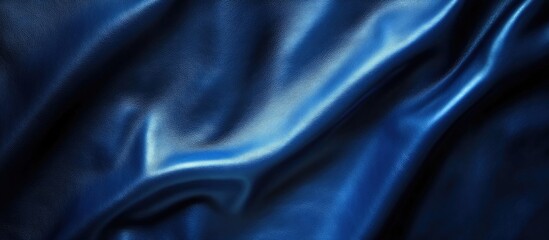 Fototapeta premium Elegant blue leather texture with smooth grain pattern ideal for backgrounds and design projects. Perfect for luxurious and stylish concepts.