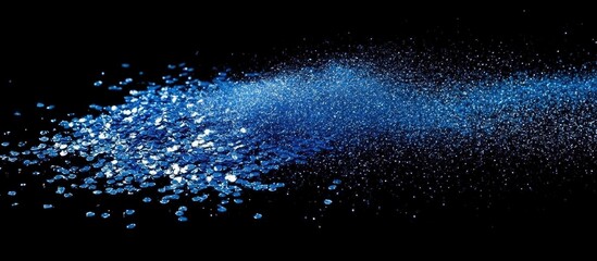 Blue Glitter Dust on Black Background Magical Sparkle Effect with Ample Copyspace for Textual Additions and Creative Designs
