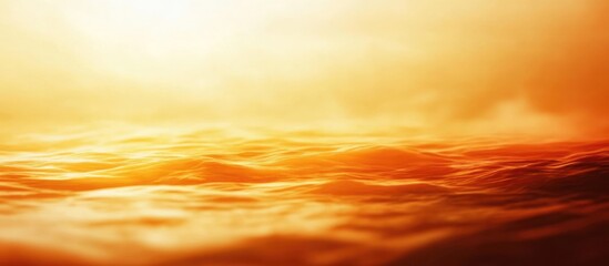 Obraz premium Golden Sunset Over Ocean Waves Blurred Background with Ample Copyspace for Text in a Peaceful Summer Atmosphere