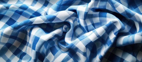 Classic blue checkered fabric texture background with ample copy space for design purposes.