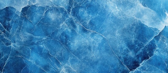 Fototapeta premium Blue marble stone texture showing intricate patterns and variations for use in design, backgrounds, and abstract art applications.