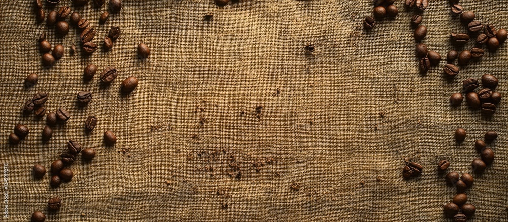 Poster Coffee Beans on Burlap Canvas Background with Copy Space for Branding or Advertising Use