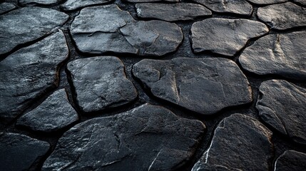 Fototapeta premium Dark stone pavement texture, outdoor, sunlight, background