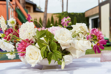 Arranged pink flowers bouquet. Artistic flower assortment with roses and mixed blooms. Design layouts and lifestyle magazines.