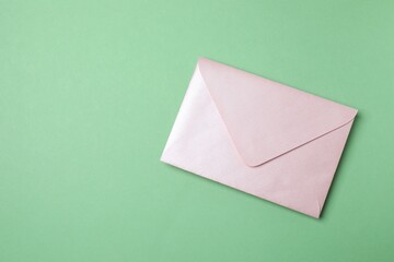 Paper envelope on green background