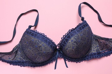 Flat lay with women romantic underwear on pink background, top view