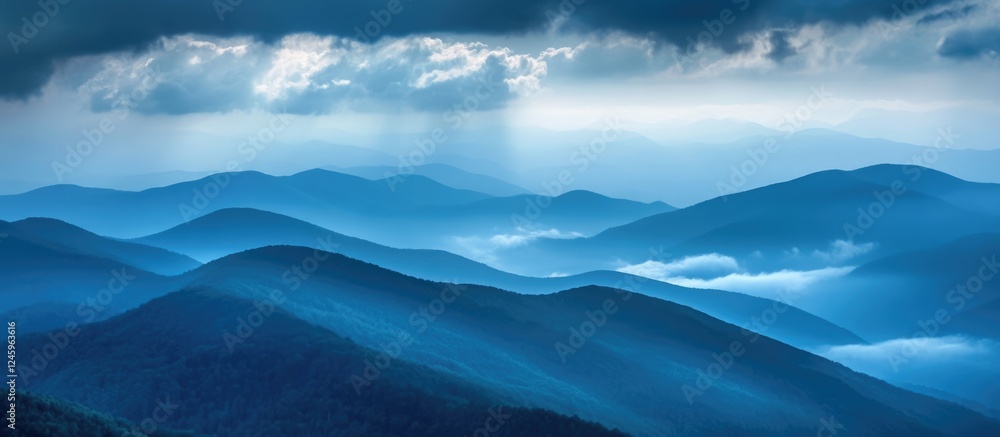 Poster dramatic mountain ridge under dense clouds with soft blue hues and empty space for text or design el