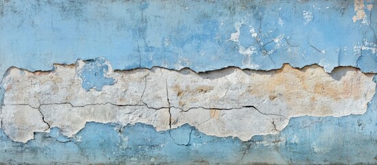 Fototapeta premium Aged blue grunge plastered wall texture with peeling paint and cracked surface for rustic or vintage backgrounds in design projects