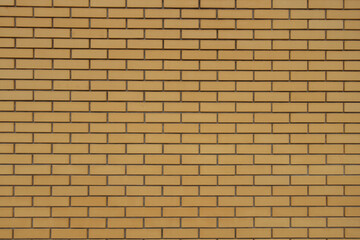 Background - sand yellow smooth brick wall with running bond