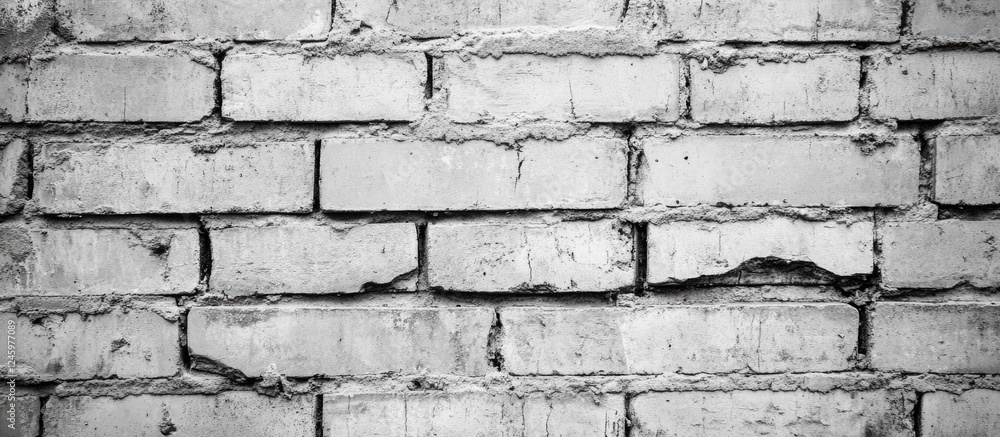 Poster textured closeup of horizontal grey brick wall background for architecture and design projects
