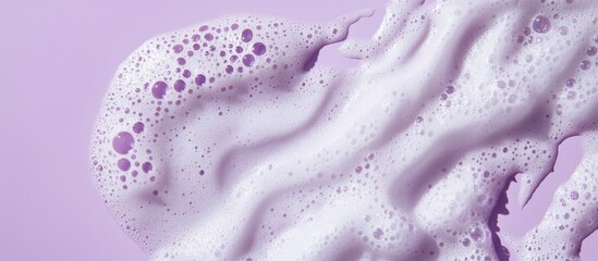 Purple foam texture on lilac background with bubbles and shadows Natural light enhancing cleansing cosmetic for skincare top view