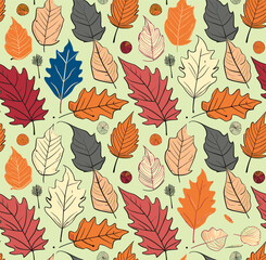 Repeating pattern of colorful autumn leaves in various shapes and sizes against a light green background.
