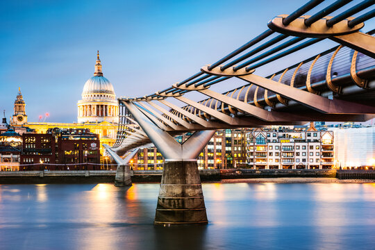 Millennium bridge and St Paul's cathedral at dusk, London, United Kingdom