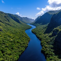 Aerial view of a river flowing through a lush green valley.