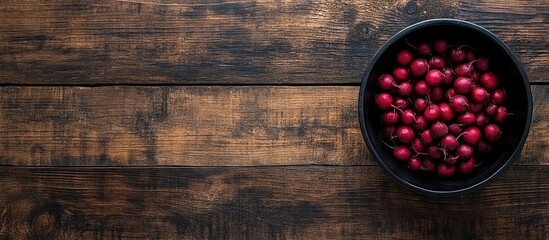 Fresh Chioggia Beets in Black Bowl on Rustic Wooden Table with Negative Space for Text and Design Elements