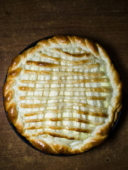 A pie with lattice on top of it sitting on a table