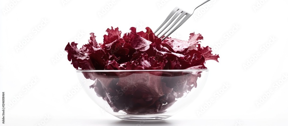 Poster fresh red lettuce salad in clear bowl with fork and blank space for text presentation or culinary de