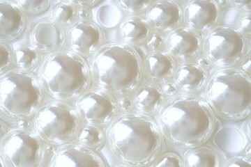 Closeup of Shiny White Pearlescent Bubbles in Abstract Light Reflection Background Texture
