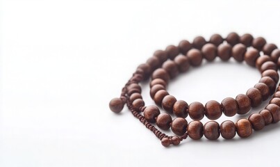 Wooden Prayer Beads on White Background for Meditation and Mindfulness to Enhance Your Spiritual Practice and Promote Inner Peace.
