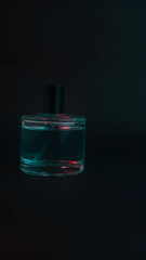 bottle of perfume on black background