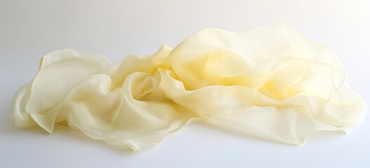 Cream silk scarf draped, white background