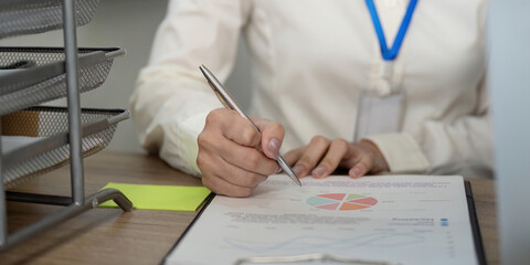 Business team collaboration office space document review professional environment close-up view...