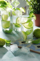 A glass with basil and lime lemonade