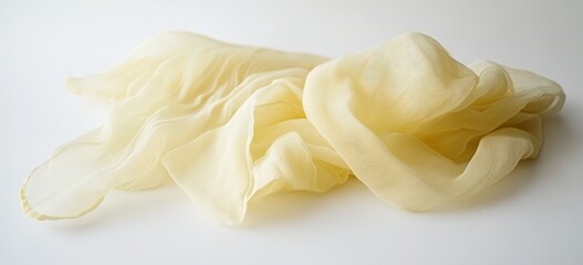 Pale yellow silk scarf, draped, white background, fashion website
