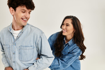 Stylish young couple having fun in a modern studio environment with trendy outfits