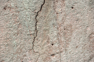 The old cracked cement and dirt and corrosion