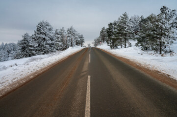 Fototapeta premium Dangerously Slippery Road in Mountain Sky Resort in Winter
