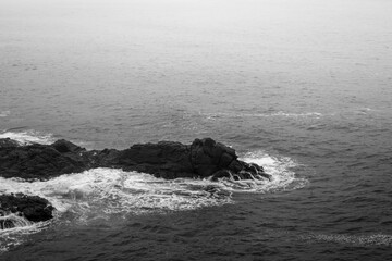 waves crashing on rocks
