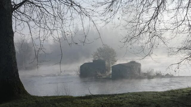 Timelapse of an early morning mist caused by a temperature inversion, sweeping over Cavado River at Adaufe, Braga, Portugal