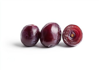 Ripe plums, halved, studio shot, white background, food