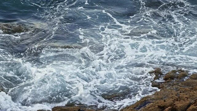 Ocean Waves Crashing Against Coastal Rocks