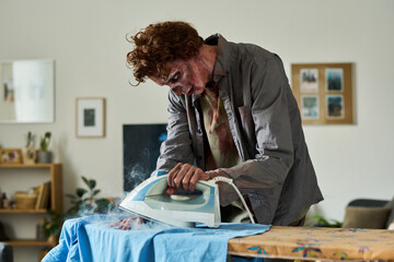 Male Zombie Trying To Iron Clothes