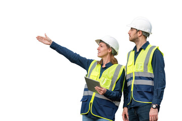 Engineers wearing safety gear, including hard hats examining survey standing industrial facility...