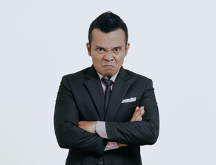 Angry and crazy Asian boss manager businessman in black suit, isolated over white background.
