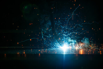 Fototapeta premium welding machine close-up and flying calves macro