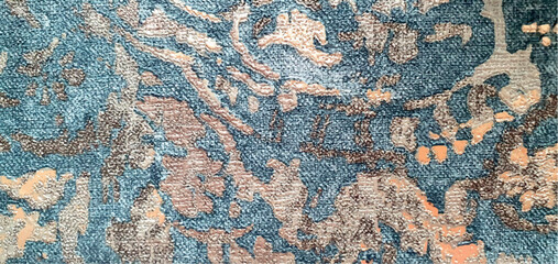 Abstract stains blue and gold texture of non-woven wallpaper. Modern rich abstraction with gold luxury cover. Vintage ornament with sea gold, jacquard. Interior design, wallpaper, upholstery, carpet.